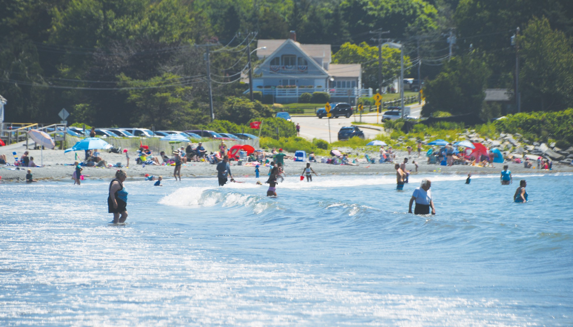 Swimmers and families at Mackerel Cove Beach in Jamestown
