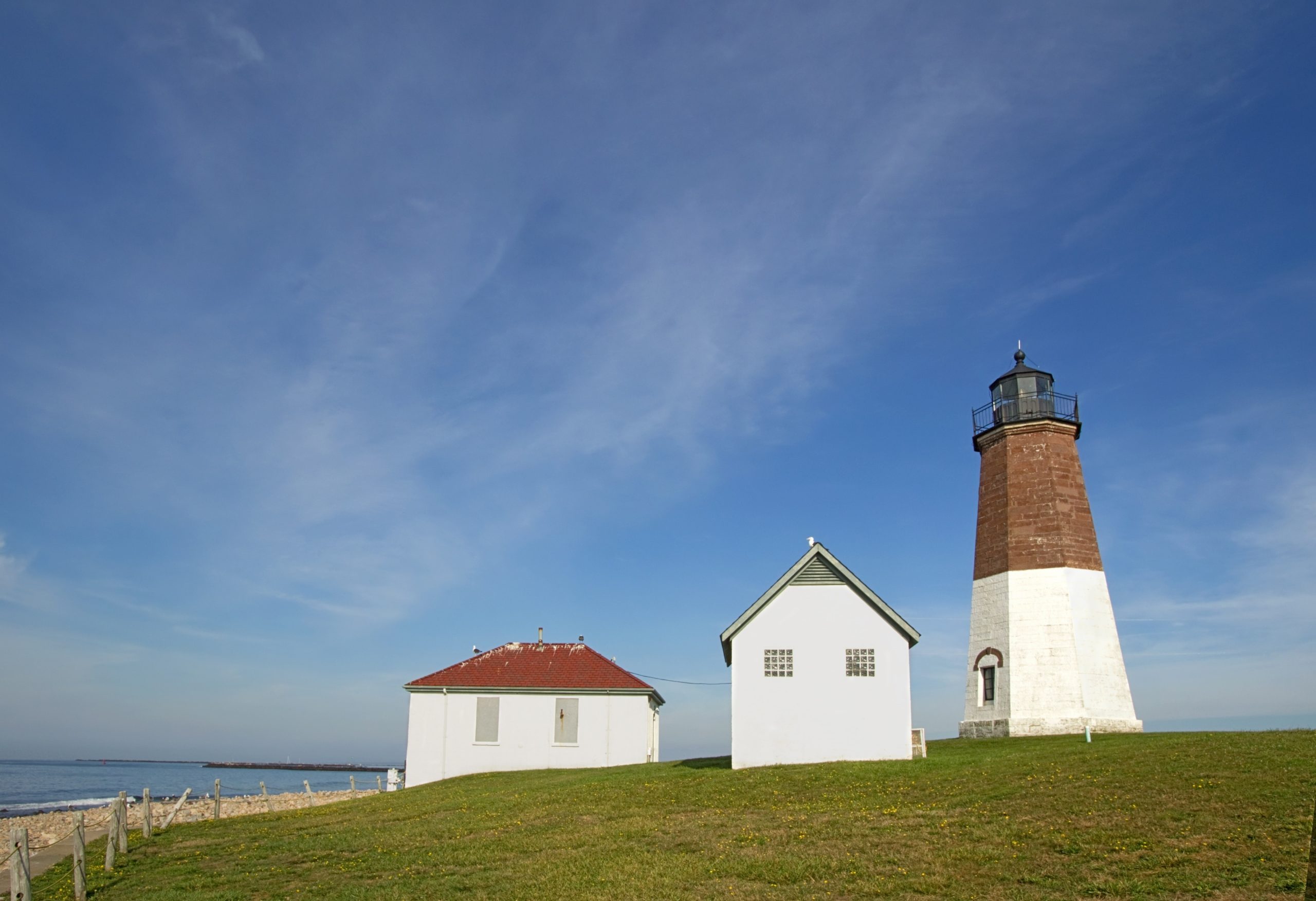 Point Judith Lighthouse beneath a clear blue sky