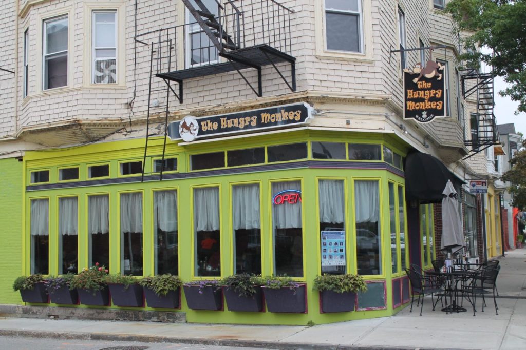Bright green exterior of The Hungry Monkey restaurant in Newport